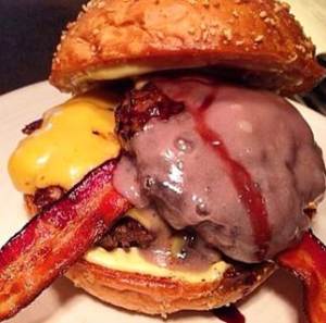 “Lakers Pride Burger” ($14) loaded with two (three-ounce) burger patties, pig candy, habanero mayo, and a red wine reduction. 